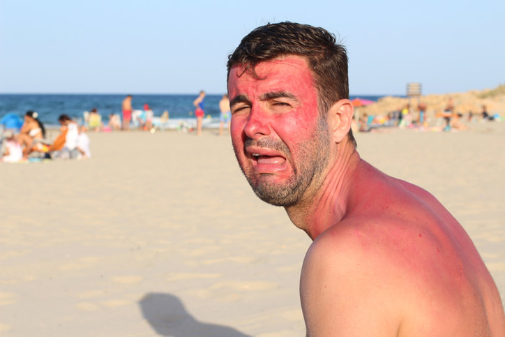 Picture of man crying on beach with sunburn, bad estate planning can harm your family
